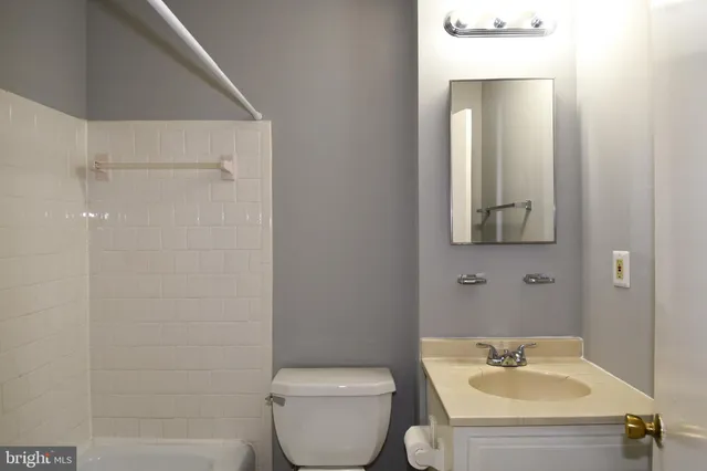 a bathroom with a bath tub with a shower