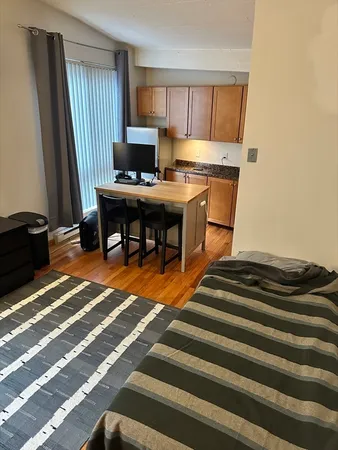 a workspace with furniture and a rug