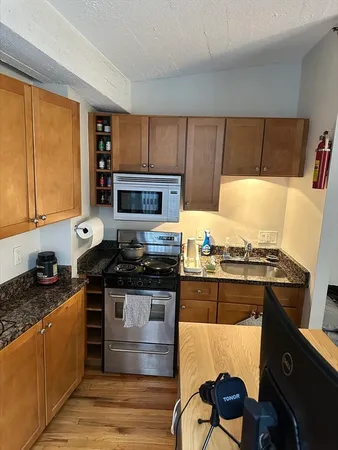 a kitchen with a stove and a microwave