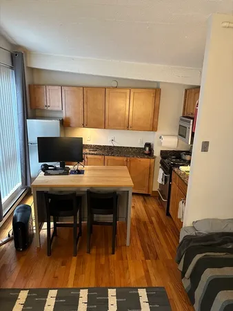 a view of a workspace with furniture and a couch