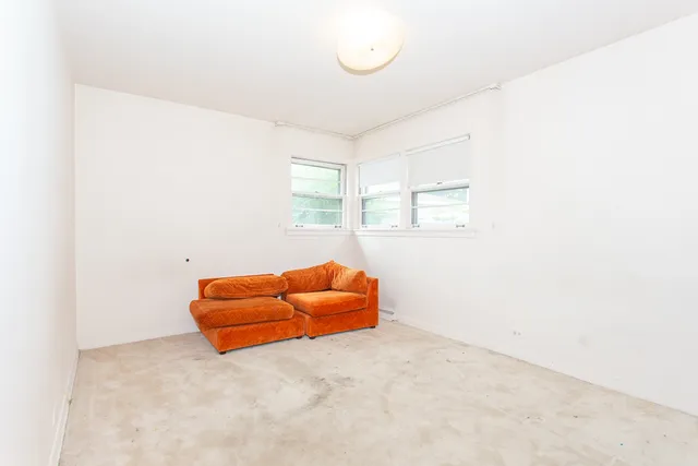 an empty room with a couch