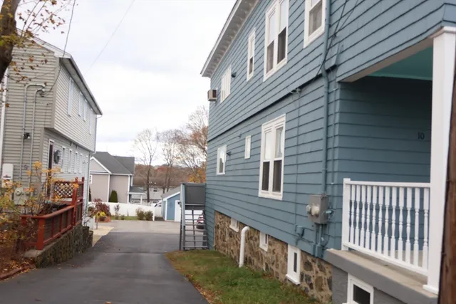 a bedroom with a bed and a flat tv screen