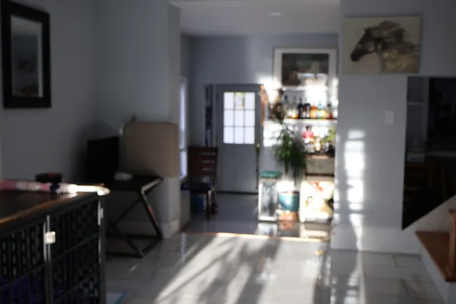 a bedroom with a bed and a flat tv screen