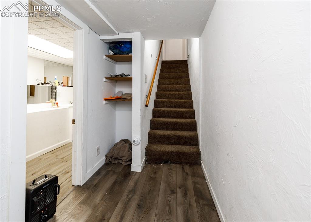 2010 East Routt Avenue Pueblo, CO 81004 - Photo 15 of 24 a view of hallway with wooden floor and staircase