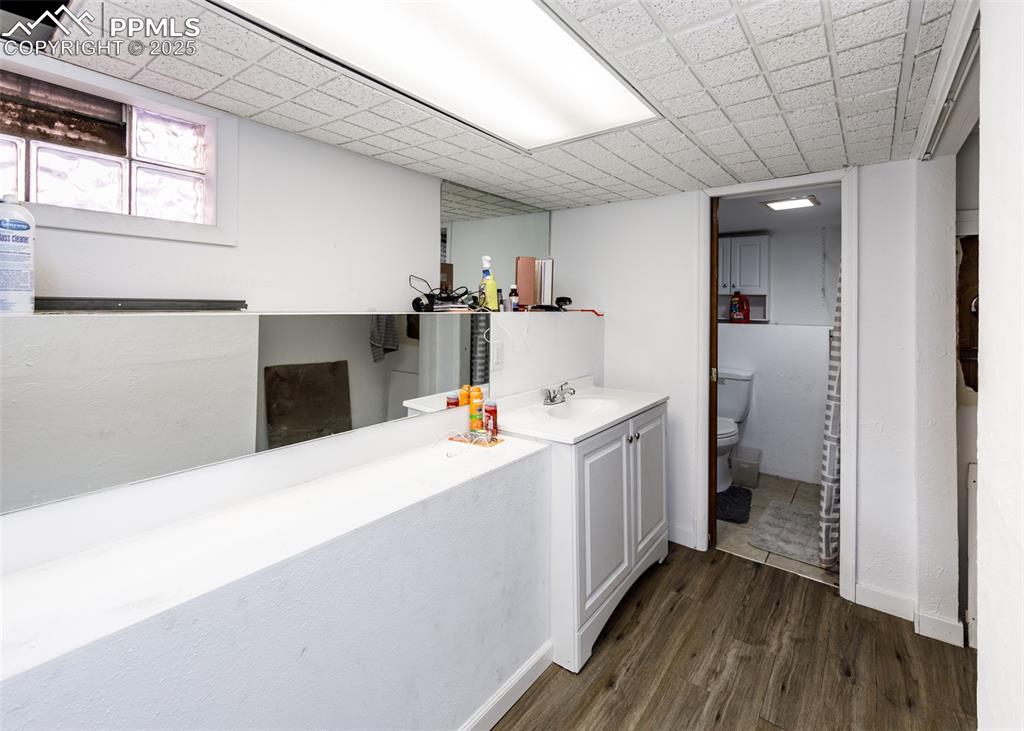 2010 East Routt Avenue Pueblo, CO 81004 - Photo 18 of 24 a storage room with wooden floor and furniture