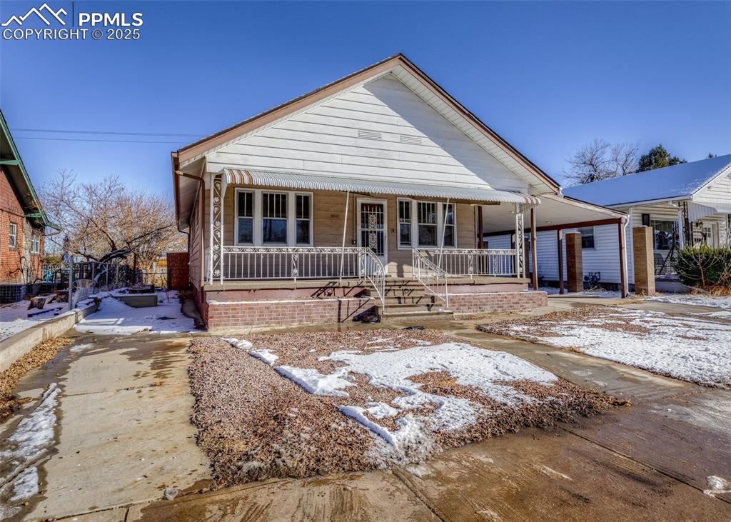 2010 East Routt Avenue Pueblo, CO 81004 - Photo 2 of 24 a front view of a house with a yard patio and outdoor seating
