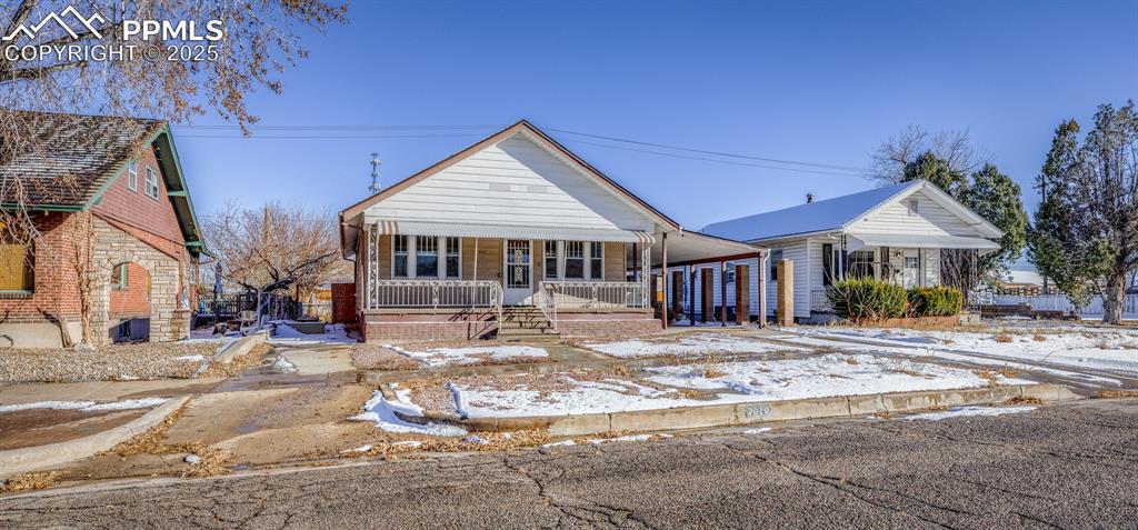 2010 East Routt Avenue Pueblo, CO 81004 - Photo 24 of 24 a front view of a house with a yard
