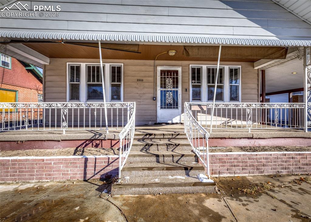 2010 East Routt Avenue Pueblo, CO 81004 - Photo 3 of 24 front view of a house with a porch