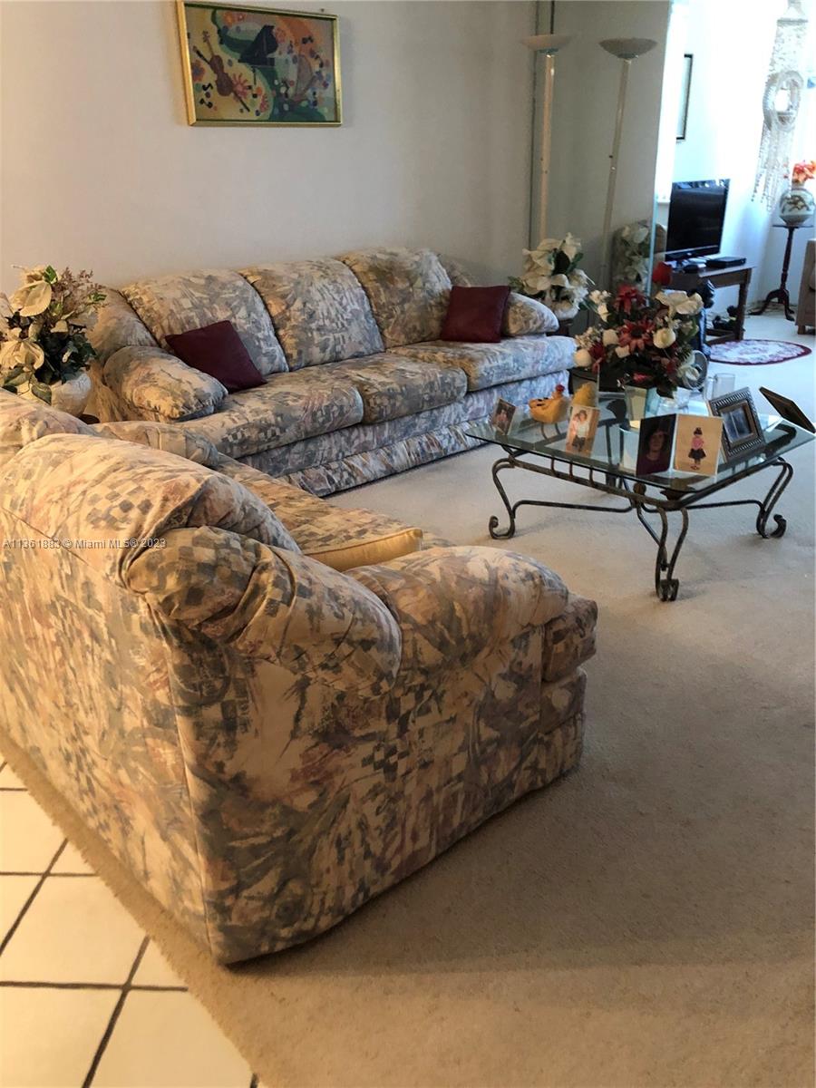 Royal Oaks Miami, FL 33179 - Photo 13 of 18 a living room with furniture and a couch