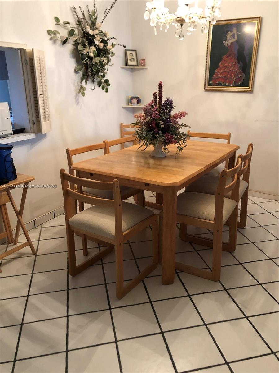 Royal Oaks Miami, FL 33179 - Photo 14 of 18 a view of a dining room with furniture