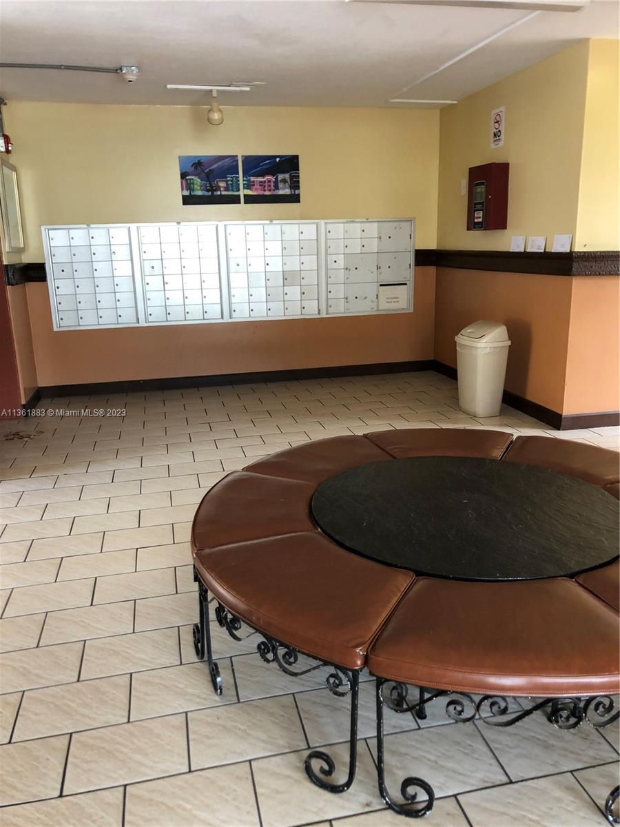 Royal Oaks Miami, FL 33179 - Photo 15 of 18 a room with a table and a chair