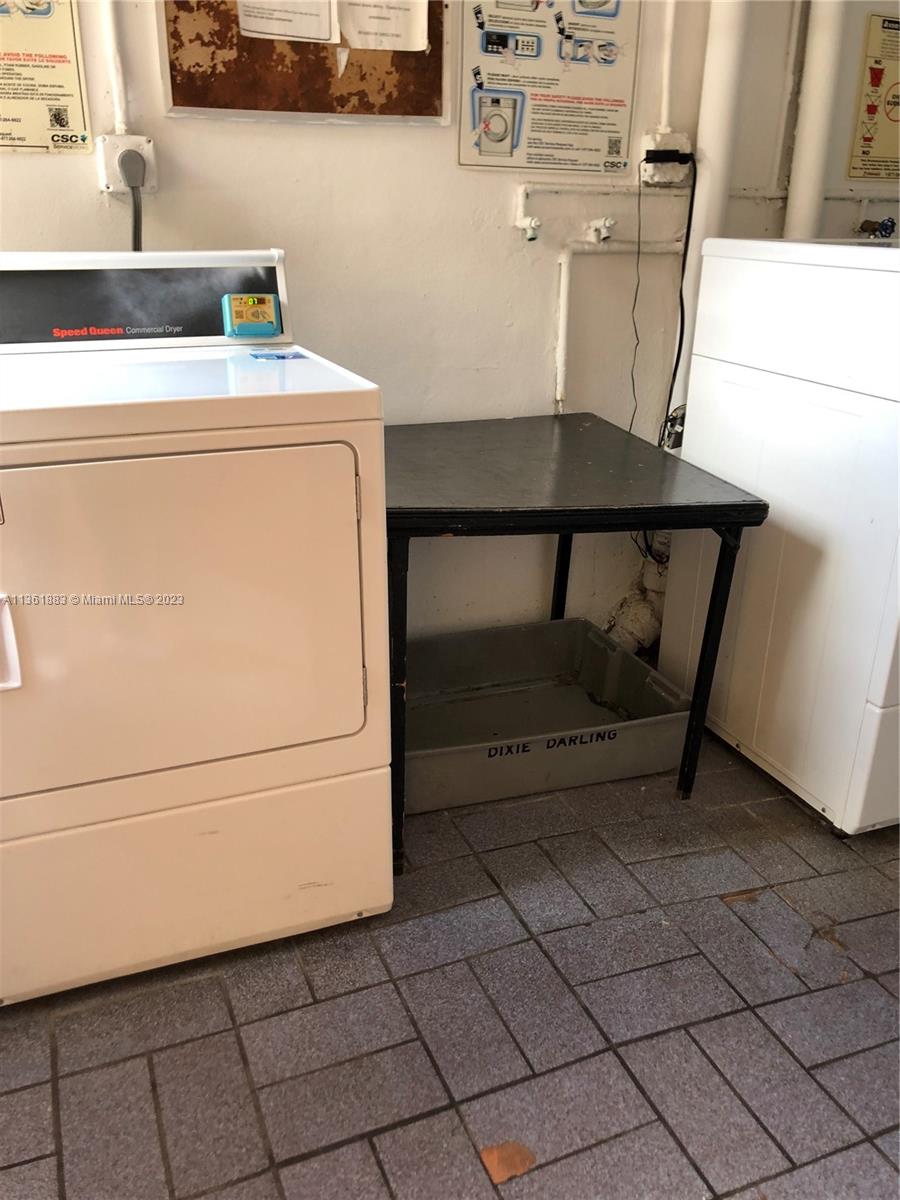 Royal Oaks Miami, FL 33179 - Photo 17 of 18 a utility room with dryer and washer