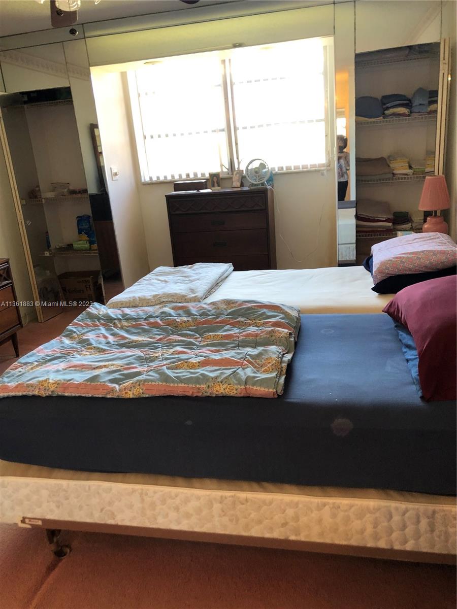 Royal Oaks Miami, FL 33179 - Photo 4 of 18 a bedroom with a bed and window