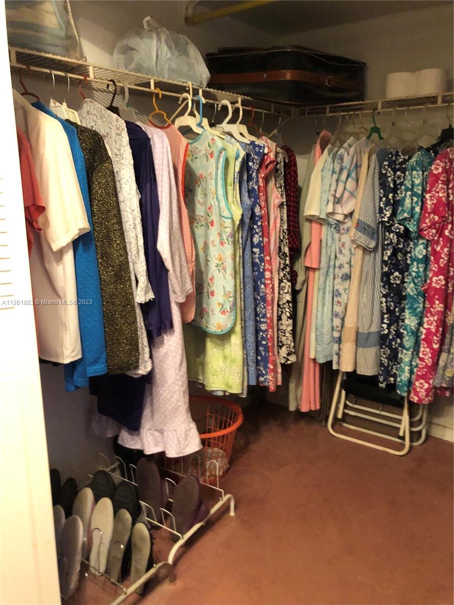 Royal Oaks Miami, FL 33179 - Photo 7 of 18 a view of walk in closet with clothes and shoes