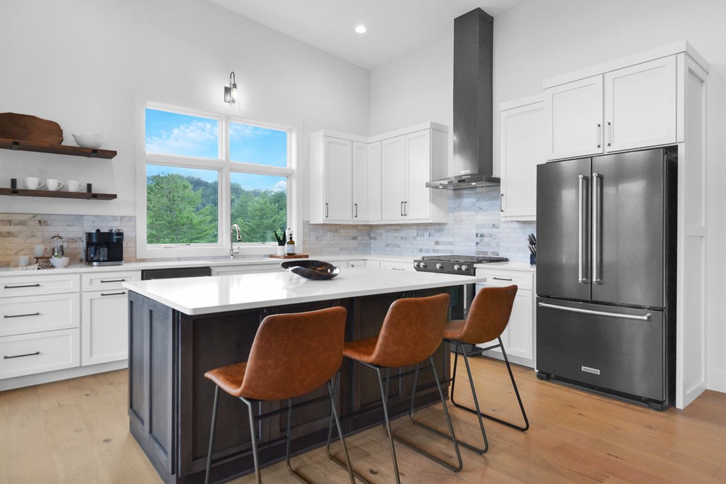 45 Eagle Watch Court Blue Ridge, GA 30513 - Photo 15 of 58 a kitchen with a refrigerator a sink and chairs