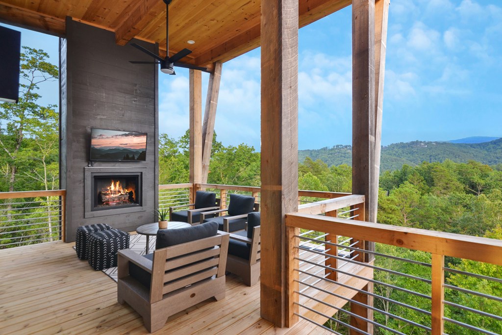 45 Eagle Watch Court Blue Ridge, GA 30513 - Photo 20 of 58 a view of a balcony with furniture and wooden floor