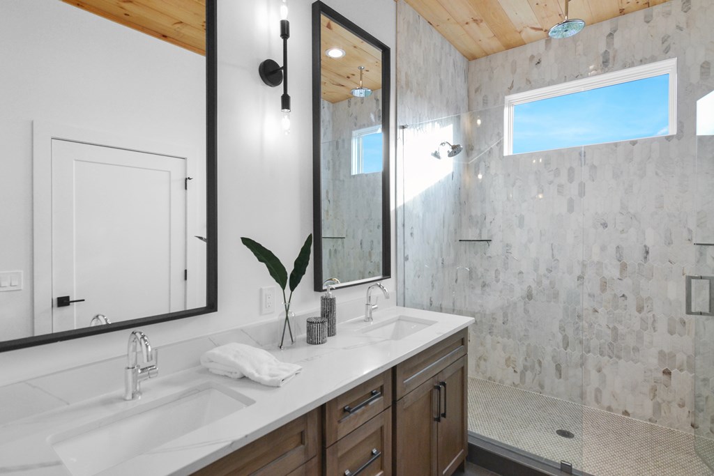 45 Eagle Watch Court Blue Ridge, GA 30513 - Photo 25 of 58 a bathroom with a granite countertop sink and a mirror