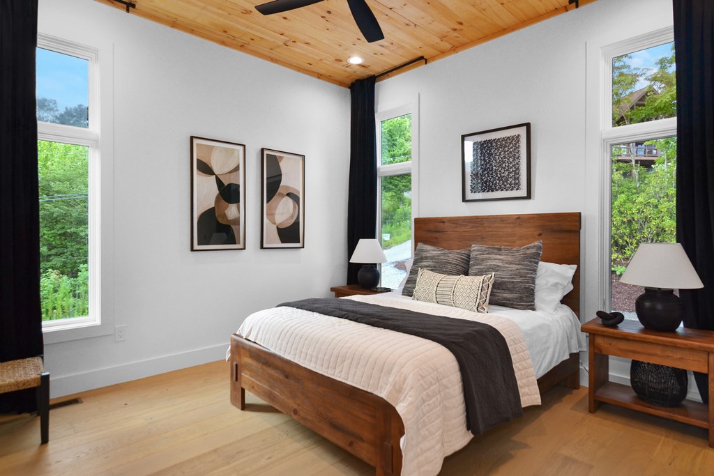 45 Eagle Watch Court Blue Ridge, GA 30513 - Photo 27 of 58 a bedroom with a bed wall painting and window