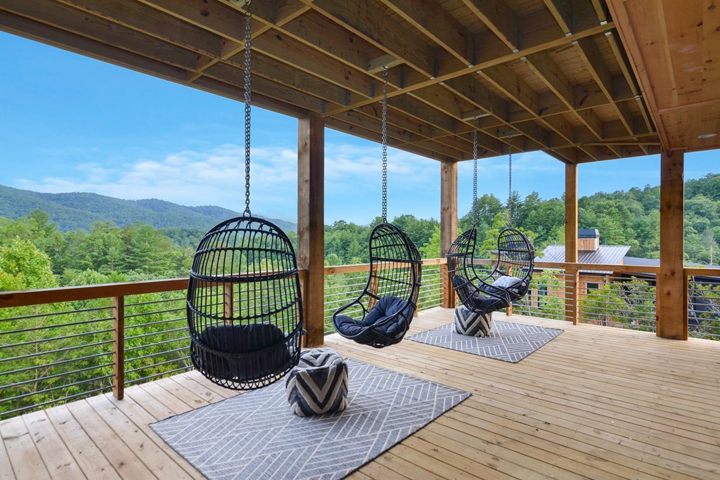 45 Eagle Watch Court Blue Ridge, GA 30513 - Photo 39 of 58 a view of a deck with wooden floor and outdoor seating