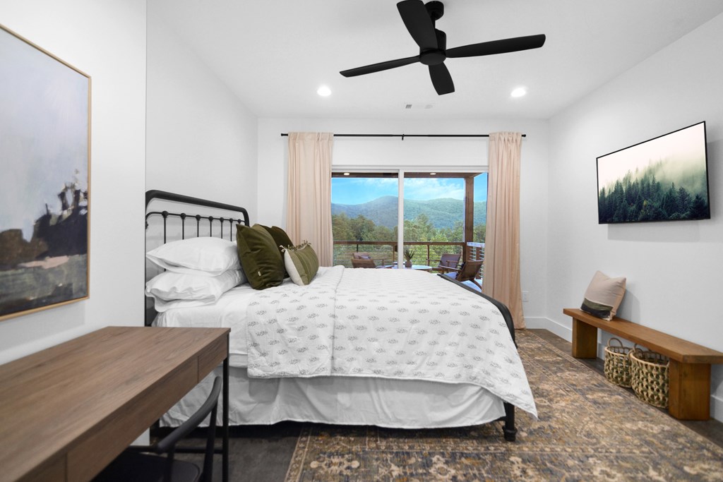 45 Eagle Watch Court Blue Ridge, GA 30513 - Photo 45 of 58 a bedroom with a bed a dresser and potted plant