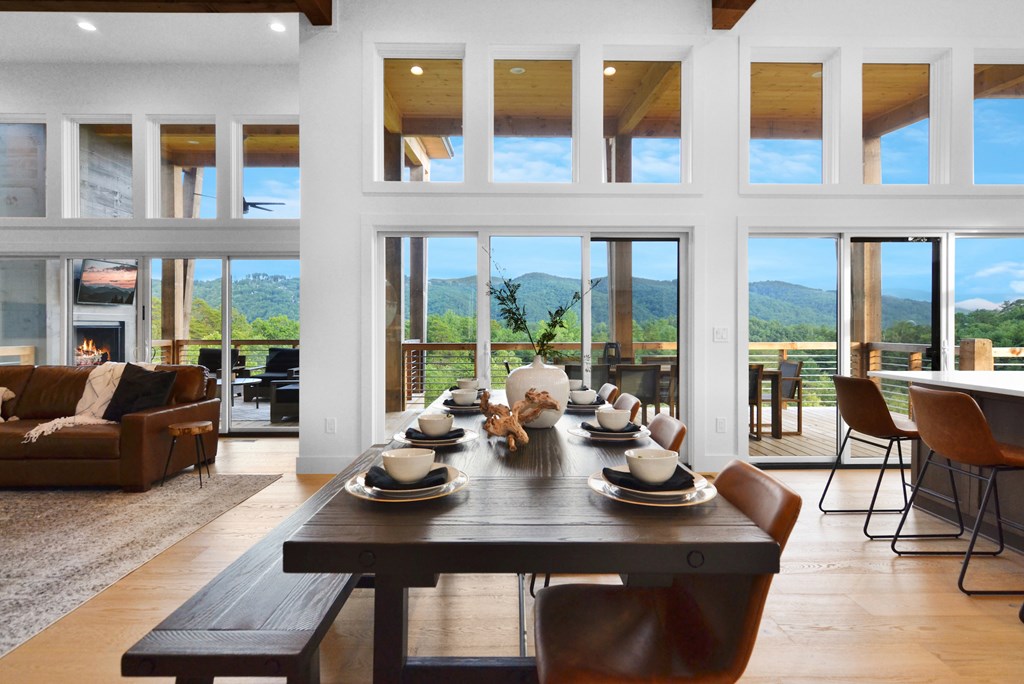 45 Eagle Watch Court Blue Ridge, GA 30513 - Photo 8 of 58 a view of a dining room with furniture large windows and wooden floor