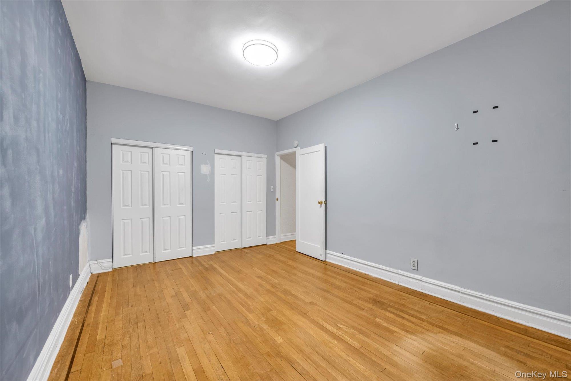 4 Maple Drive, Unit 1J Great Neck, NY 11021 - Photo 14 of 15 a view of empty room