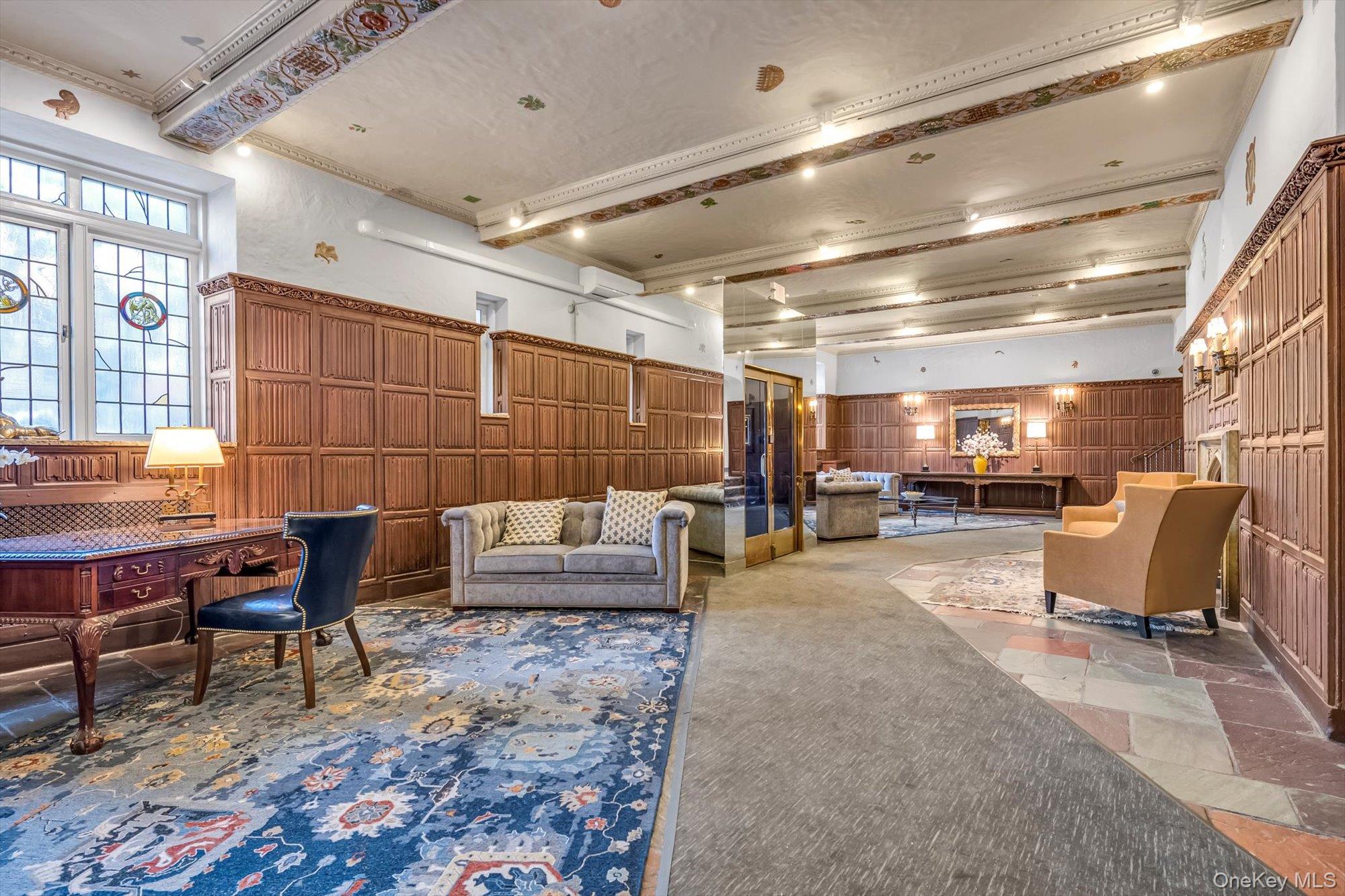 4 Maple Drive, Unit 1J Great Neck, NY 11021 - Photo 4 of 15 a outdoor space with lots of furniture and a projector