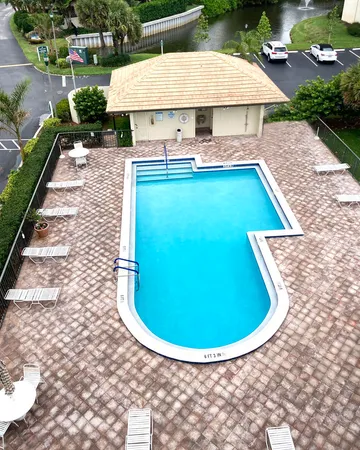 a view of a swimming pool with an outdoor space