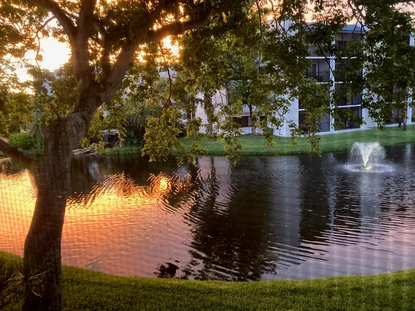 a view of house with outdoor seating and lake