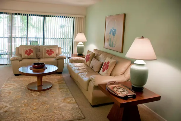 a living room with furniture and a window