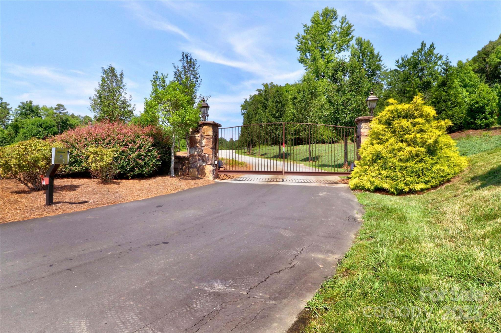 589 Sunset Pointe Drive Salisbury, NC 28146 - Photo 21 of 22 a view of a garden with plants and trees