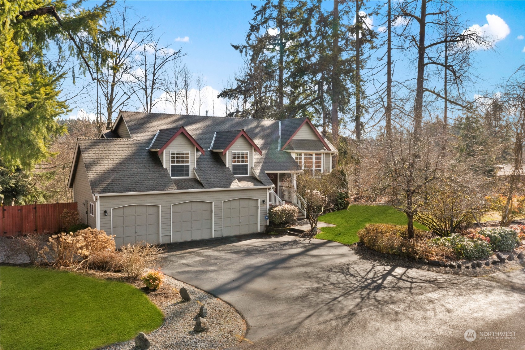 17005 51st Avenue Southeast Bothell, WA 98012 - Photo 1 of 40 a front view of a house with a garden