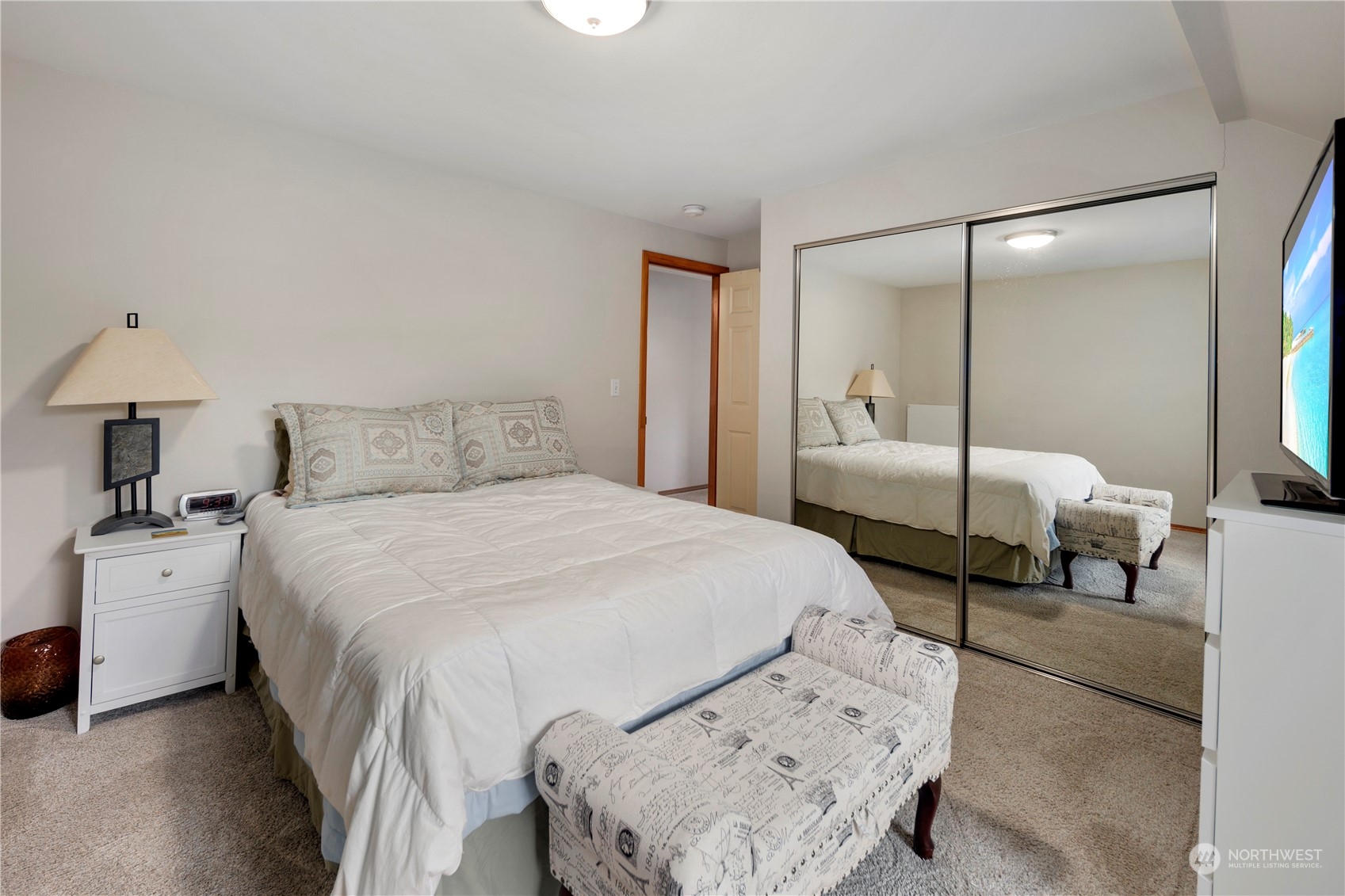 17005 51st Avenue Southeast Bothell, WA 98012 - Photo 11 of 40 a bedroom with a bed and a large mirror