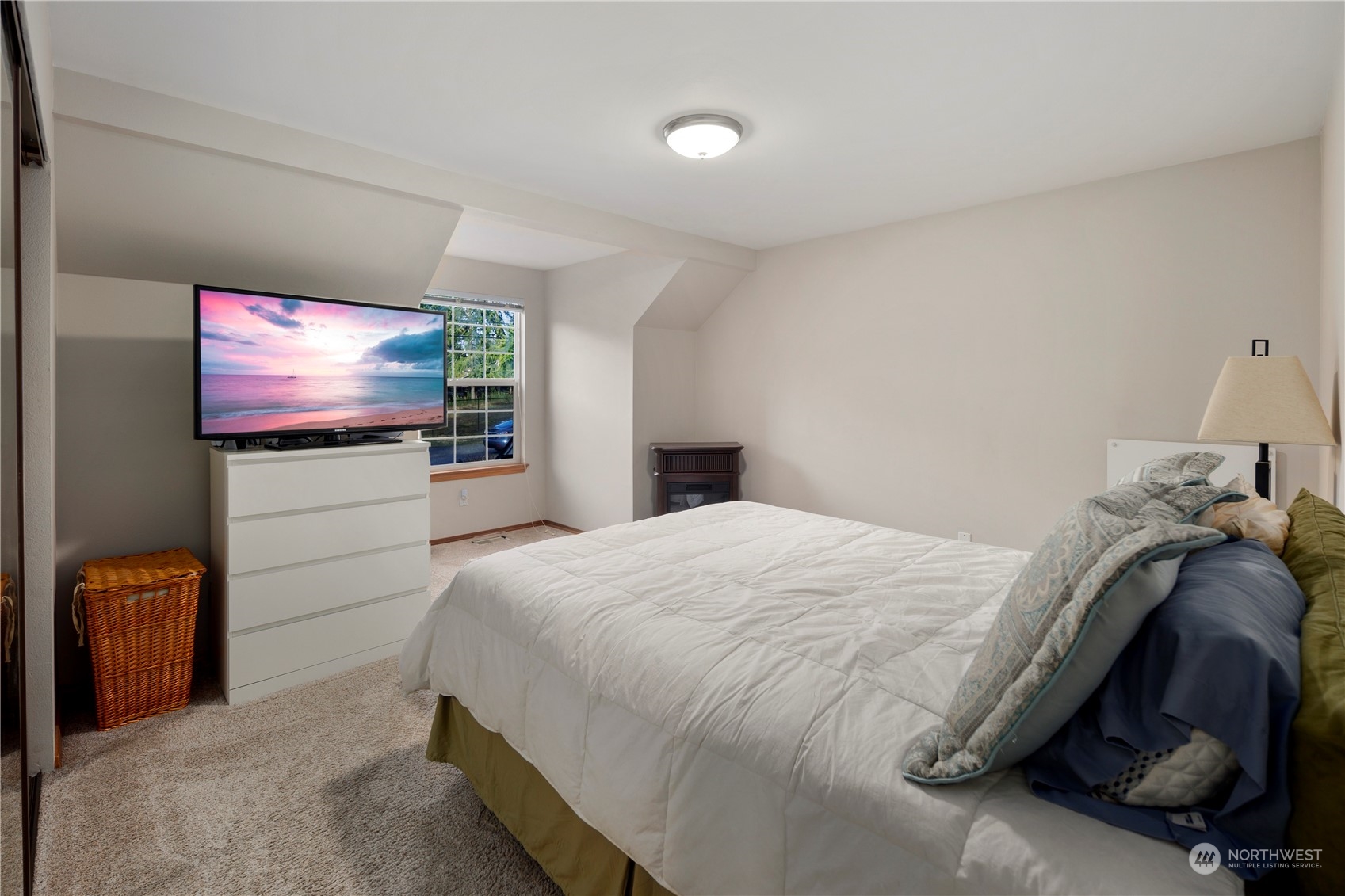 17005 51st Avenue Southeast Bothell, WA 98012 - Photo 12 of 40 a bedroom with a bed and a flat screen tv