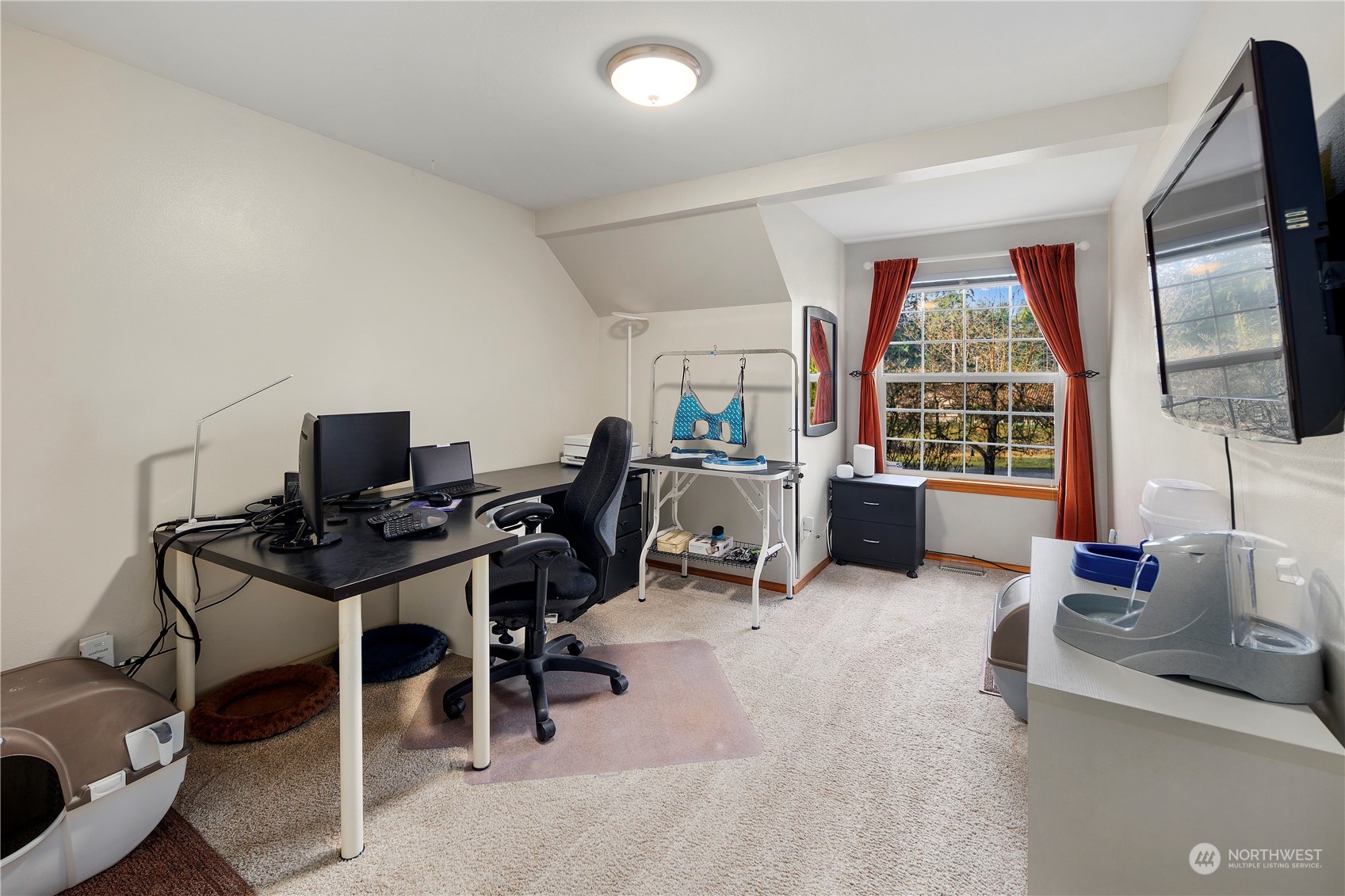 17005 51st Avenue Southeast Bothell, WA 98012 - Photo 13 of 40 a view of a livingroom with workspace and a window