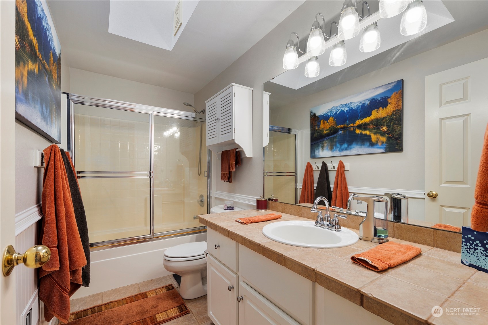 17005 51st Avenue Southeast Bothell, WA 98012 - Photo 14 of 40 a bathroom with a sink a toilet and shower