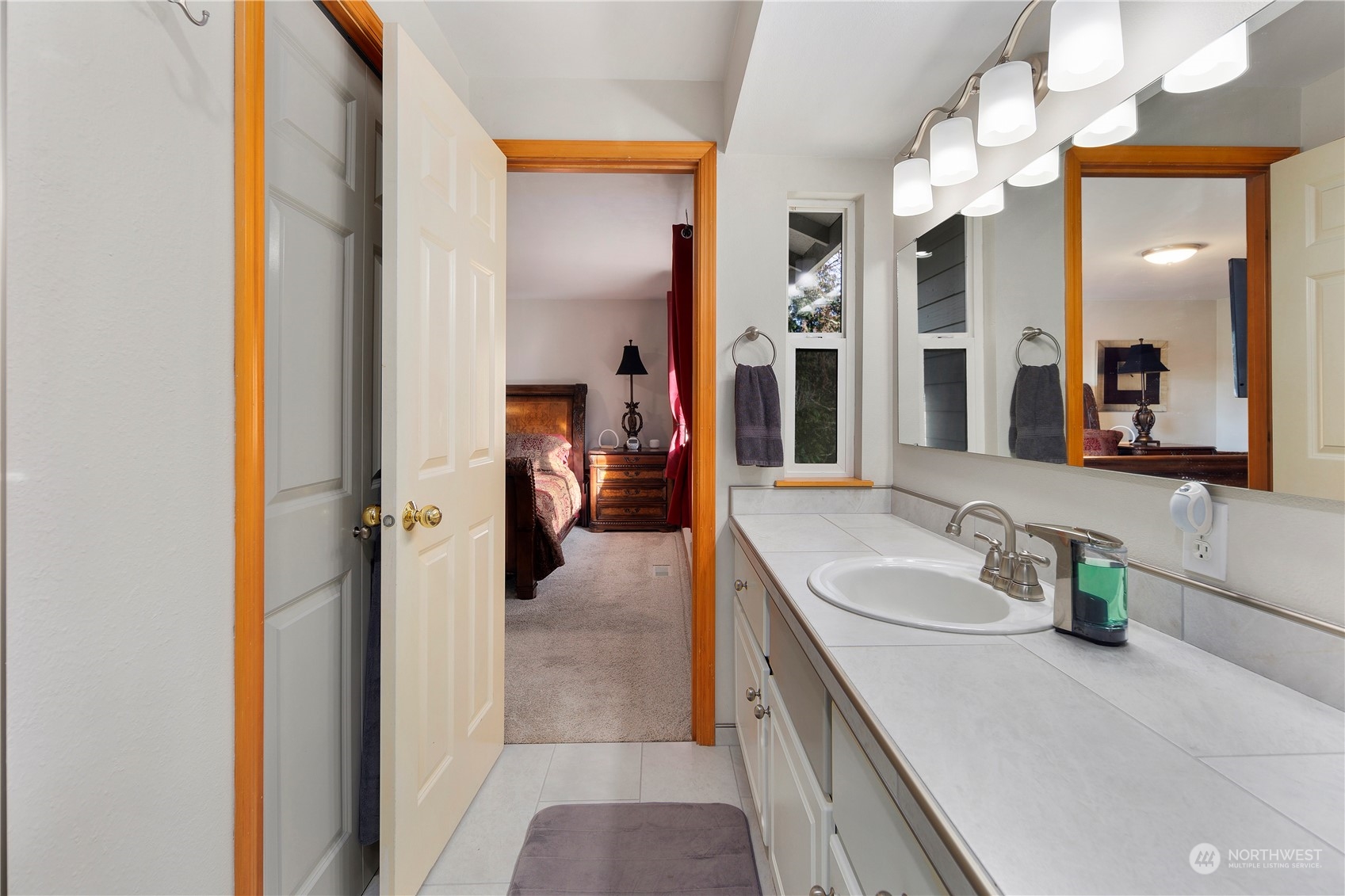 17005 51st Avenue Southeast Bothell, WA 98012 - Photo 20 of 40 a en suite bathroom with a sink and mirror