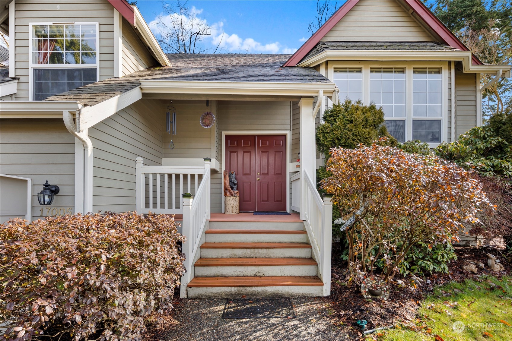 17005 51st Avenue Southeast Bothell, WA 98012 - Photo 2 of 40 a front view of a house with a garden
