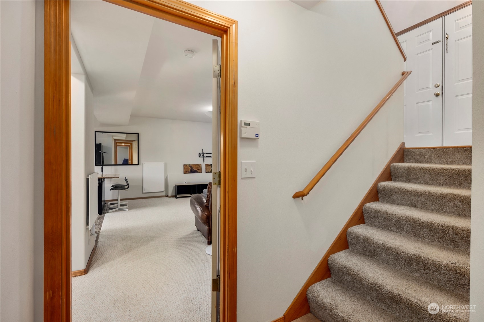 17005 51st Avenue Southeast Bothell, WA 98012 - Photo 21 of 40 a view of a hallway with wooden floor and staircase