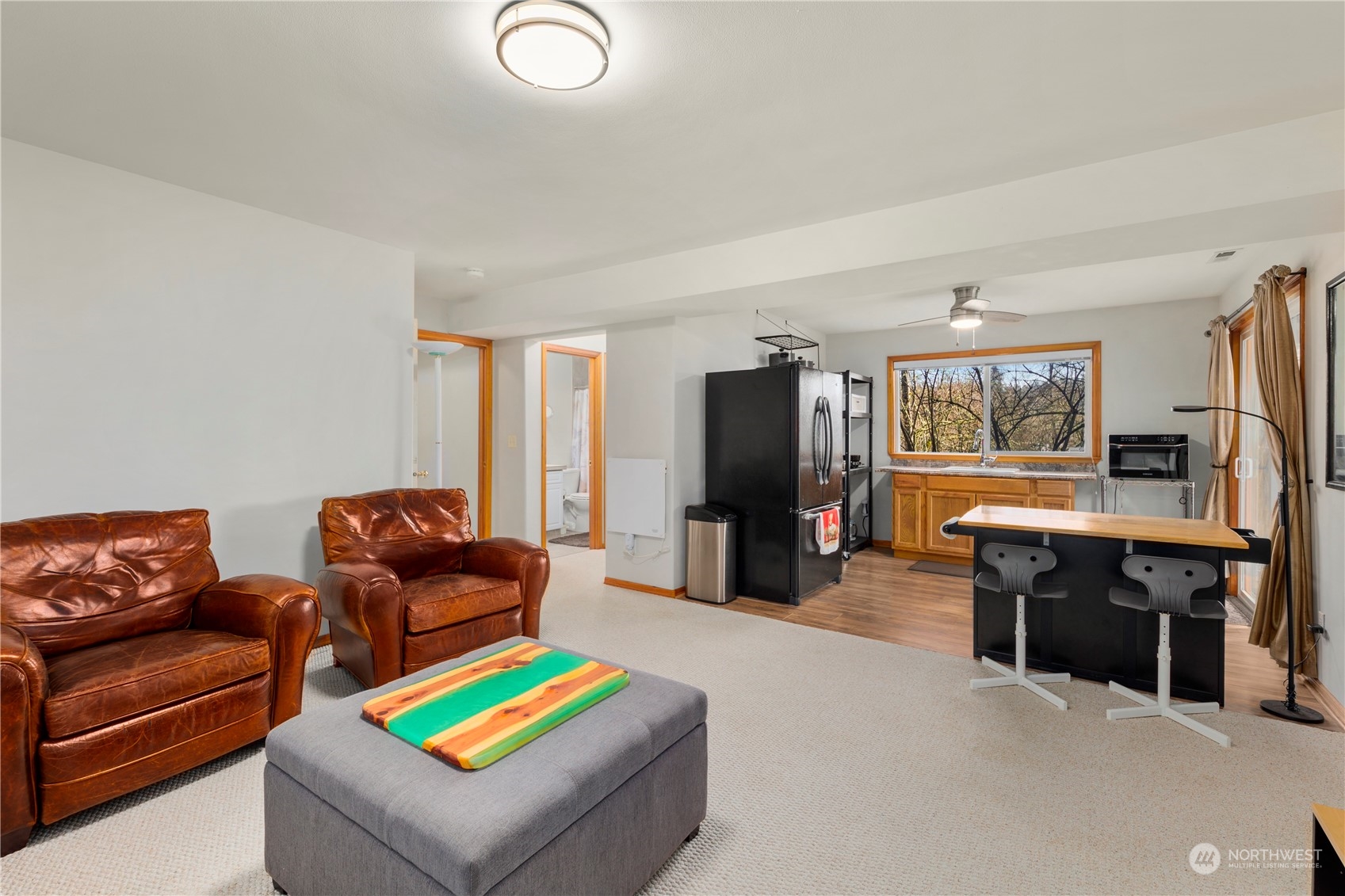 17005 51st Avenue Southeast Bothell, WA 98012 - Photo 24 of 40 a living room with furniture and a flat screen tv