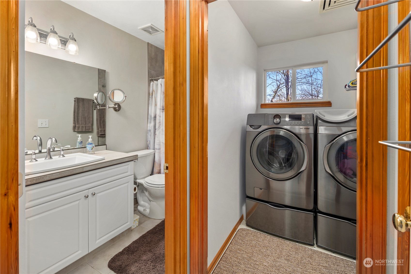 17005 51st Avenue Southeast Bothell, WA 98012 - Photo 28 of 40 a bathroom with a sink a washer and dryer