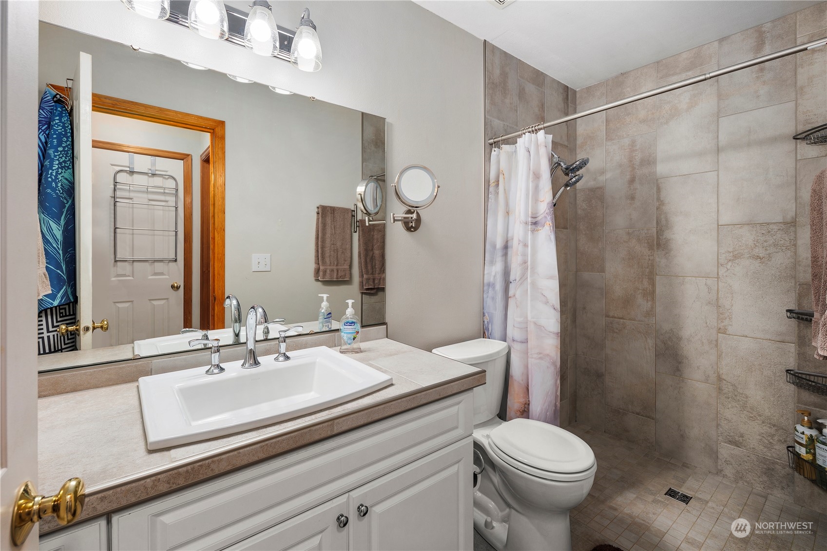 17005 51st Avenue Southeast Bothell, WA 98012 - Photo 29 of 40 a bathroom with a sink toilet and shower