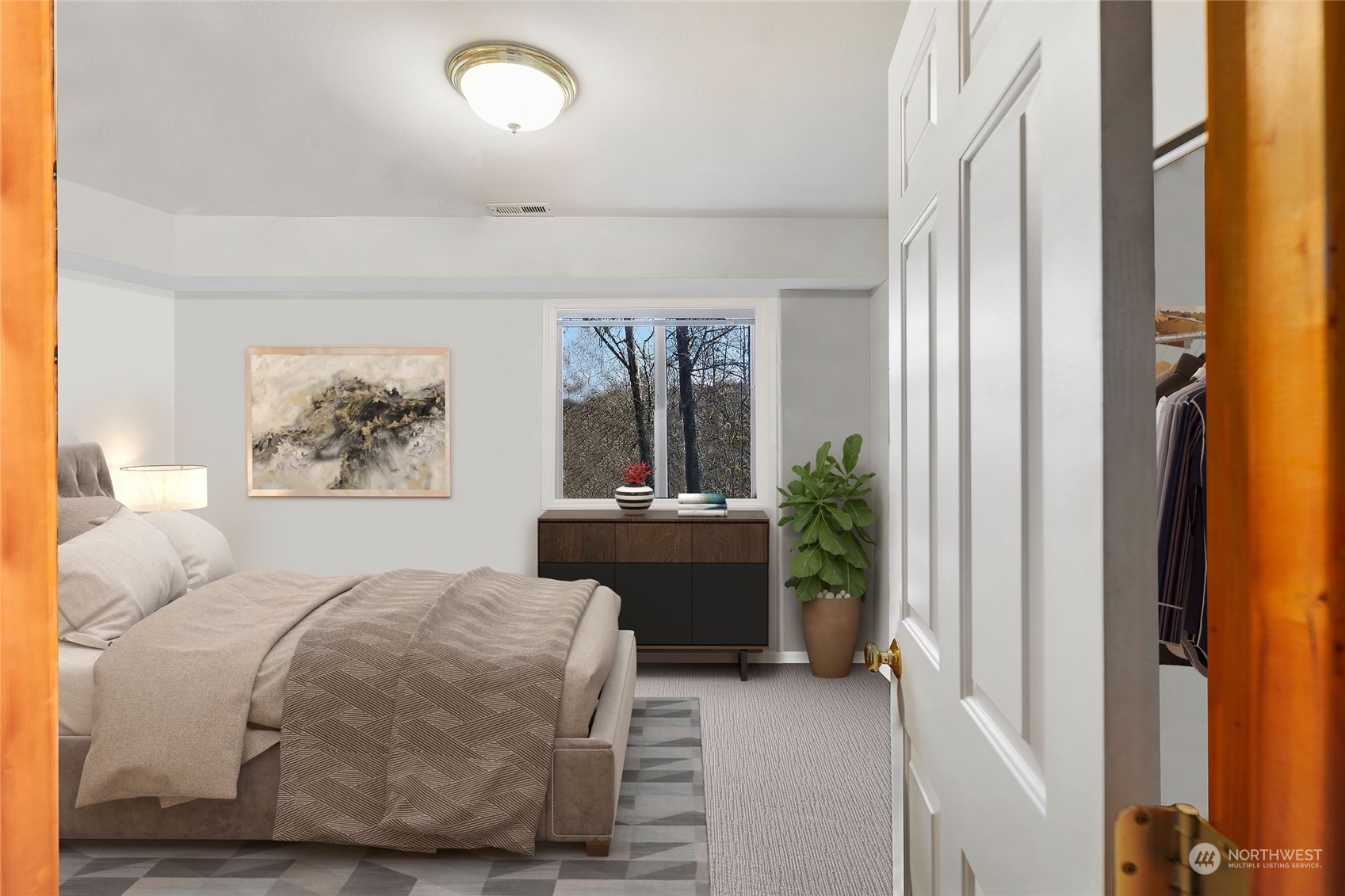 17005 51st Avenue Southeast Bothell, WA 98012 - Photo 30 of 40 a bedroom with a bed and a painting on the wall