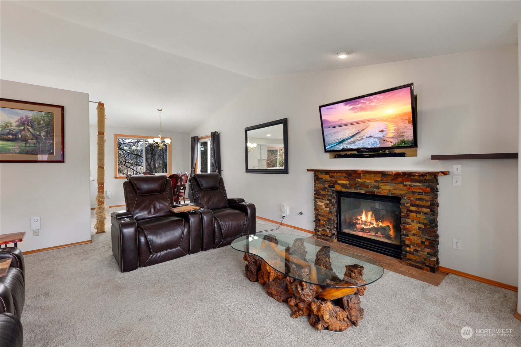 17005 51st Avenue Southeast Bothell, WA 98012 - Photo 3 of 40 a living room with furniture a flat screen tv and a fireplace