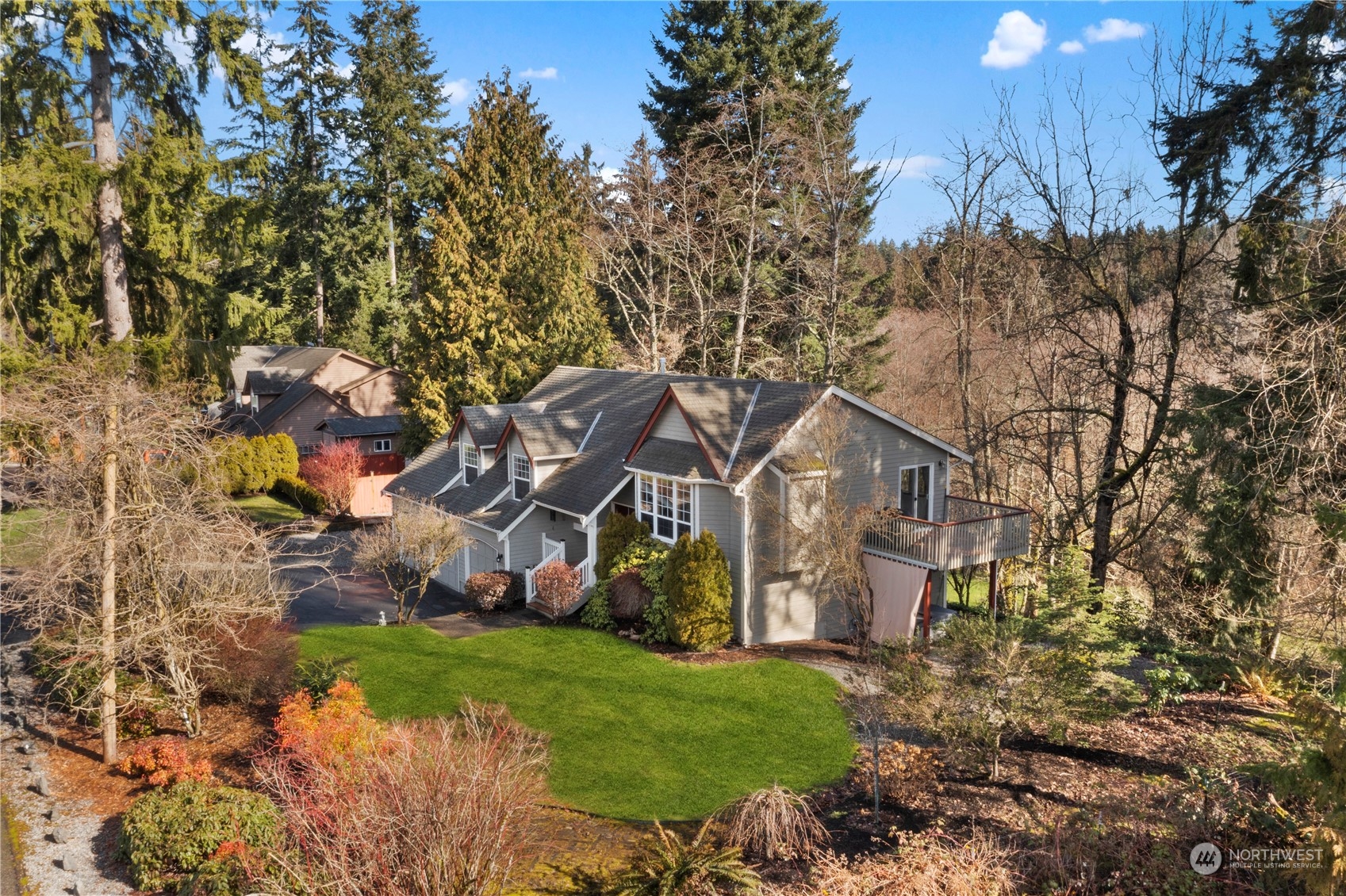 17005 51st Avenue Southeast Bothell, WA 98012 - Photo 36 of 40 a front view of a house with a yard and a tree