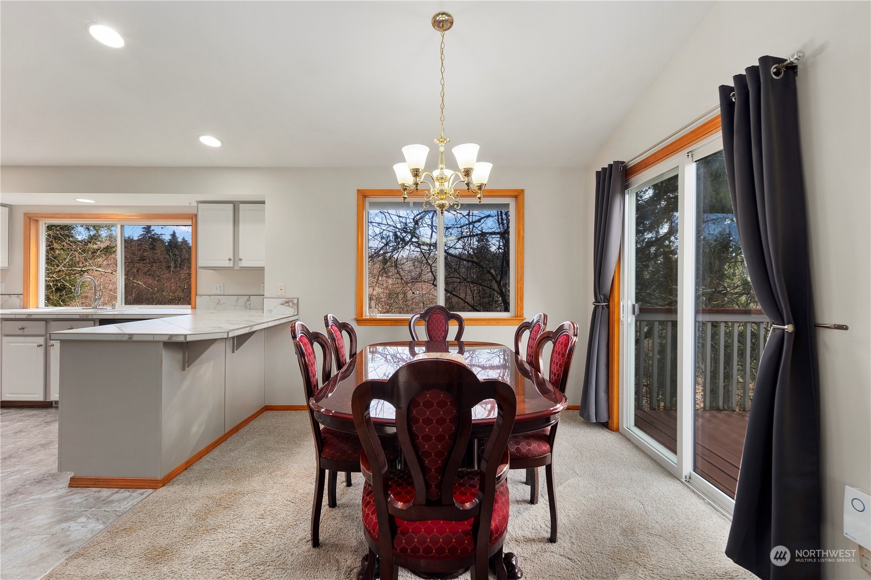17005 51st Avenue Southeast Bothell, WA 98012 - Photo 10 of 40 a dining room with furniture a chandelier and window