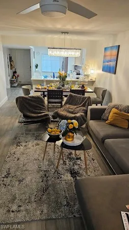 a living room with lots of furniture and a rug