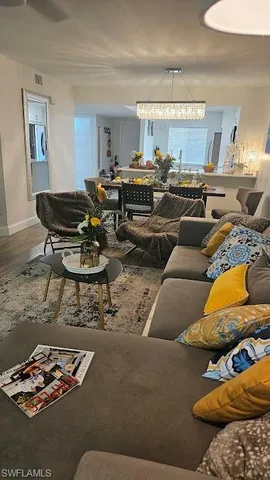 a living room with furniture and a rug