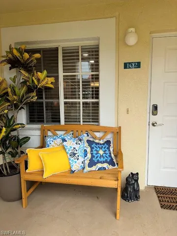 a bedroom with furniture and window