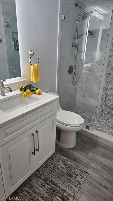 7756 Jewel Lane, Unit 102 Naples, FL 34109 - Photo 22 of 34 a bathroom with a sink toilet and shower